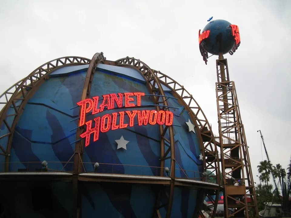 #5 Planet Hollywood (Stallone, Schwarzenegger, Willis) — 10 Most Embarrassing Celebrity Business Failures (Restaurants, NFTs & More)