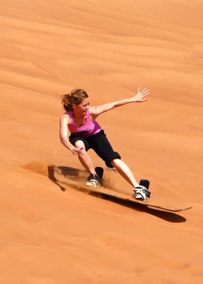 Sandboarding at Big Red Dune (Al Hamar)