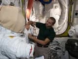#2 UAE Astronaut Sultan Alneyadi Prepares Spacesuit in Quest Airlock — Humans in Space: The Most Iconic Spacewalk Photographs Ever Taken